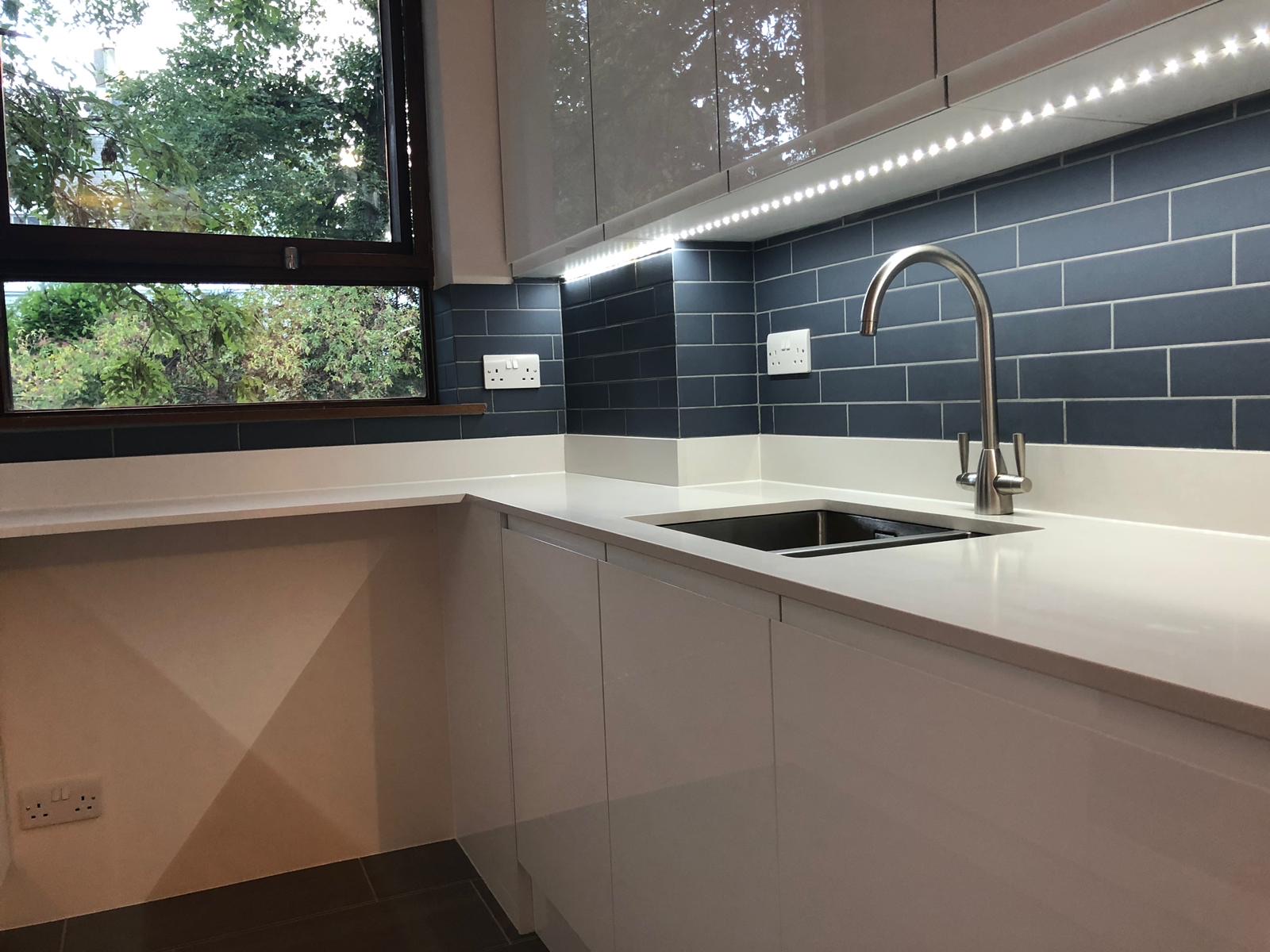 Blue subway tile splashback with LED lighting