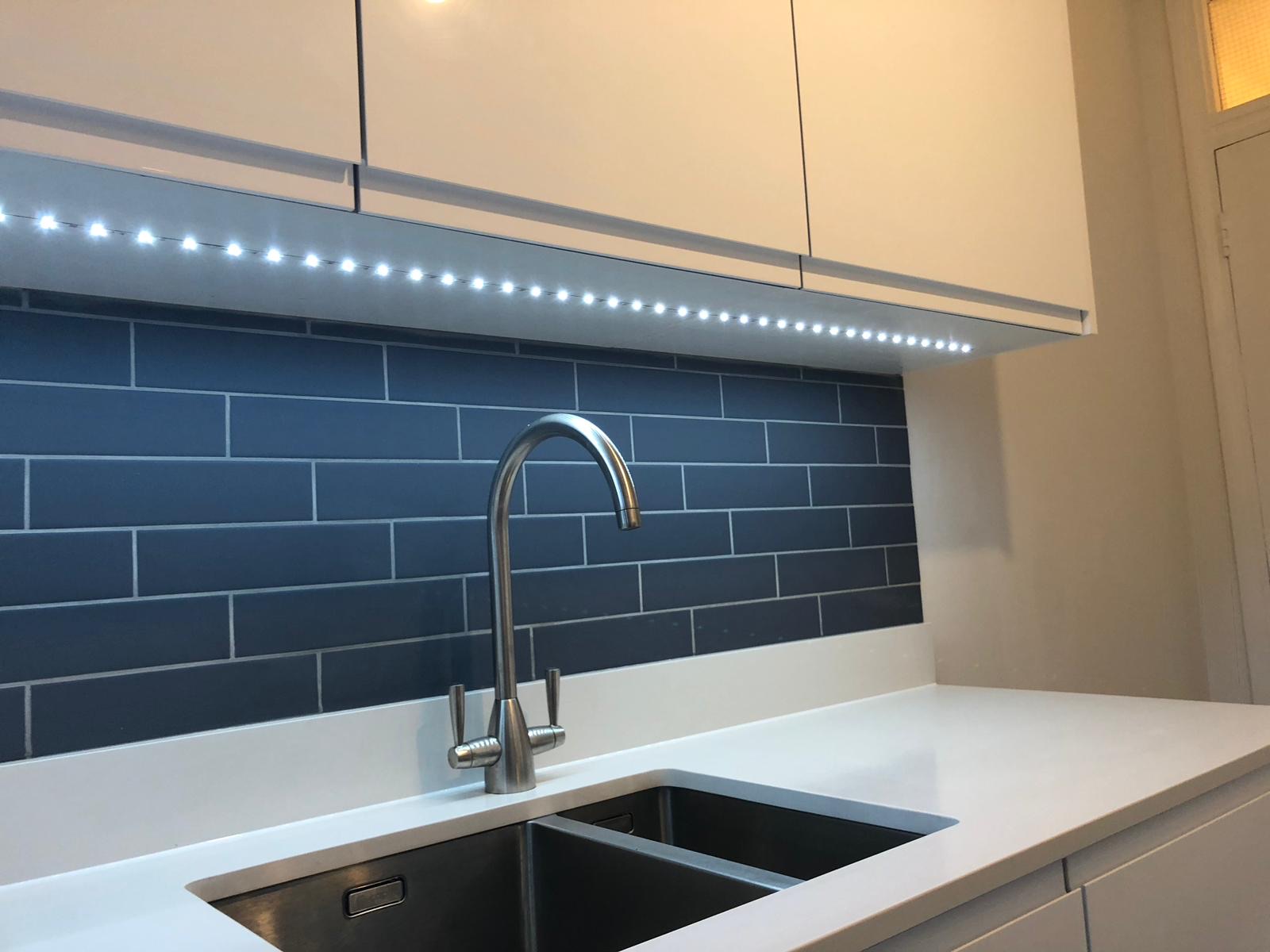 Gas hob with blue tile splashback